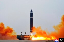 This photo provided by the North Korean government, shows what it says a test launch of a Hwasong-15 intercontinental ballistic missile at Pyongyang International Airport in Pyongyang, North Korea, Feb. 18, 2023.