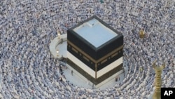 Muslim pilgrims circumambulate the Kaaba, the cubic building at the Grand Mosque, during the annual Hajj pilgrimage in Mecca, Saudi Arabia, June 11, 2024.