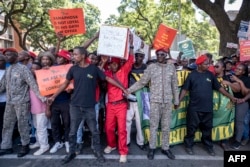 Economic Freedom Fighters (EFF) supporters march to the presidential guest house in Pretoria on March 20, 2023 during a national shutdown called by their party.