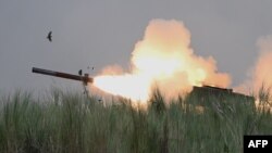 FILE - An M142 High Mobility Artillery Rocket System (HIMARS) fires during Philippine-U.S. exercises at Capas, Philippines, Oct. 13, 2022. The U.S. on Sept. 7, 2023, said it would provide $600 million in additional military aid to Ukraine, including HIMARS ammunition.