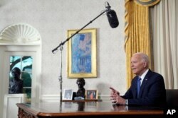 President Joe Biden addresses the nation from the Oval Office of the White House in Washington, July 24, 2024, about his decision to drop his Democratic presidential reelection bid. (Pool via AP)