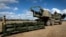 FILE - U.S. soldiers prepare to load the Army Tactical Missile System onto the High Mobility Artillery Rocket System in Queensland, Australia, on July 26, 2023, in this image provided by the U.S. Army. Ukraine is asking NATO members for long-range weapons such as the ATACMS.