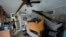 Furniture is piled high inside the canal-front home of Victor Cassano in Suwannee, Florida, as Cassano prepares for the arrival of Hurricane Idalia, Aug. 29, 2023.
