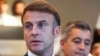 France's President Emmanuel Macron, left, gives a speech during the Paris 2024 Olympic Games in Paris, July 27, 2024. Macron urged his new Iranian counterpart Masoud Pezeshkian, July 29, 2024, to not support Russia's "war of aggression" against Ukraine.