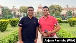 Abhay Dang and Supriyo Chakraborty, who are among the petitioners outside India's Supreme Court after attending a hearing on the case, April 20, 2023.