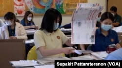 Officers prepare mail ballot packages for the Thailand General Election absentee voting in the US at the Royal Thai Consulate General Los Angeles, CA, April 19, 2023