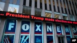 FILE - A headline about President Donald Trump is displayed outside Fox News studios in New York on Nov. 28, 2018.