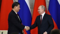 Xi i Putin se rukuju tokom susreta u Moskvi, 21. mart 2023.