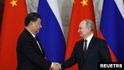 Perezida Xi Jinping, w'Ubushinwa na Perezida Vladimir Putin w'Uburusiya
