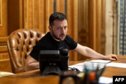 This handout photograph shows Ukrainian President Volodymyr Zelenskyy speaking during his telephone call with Britain's Prime Minister Rishi Sunak in Kyiv, June 19, 2023. (Photo by handout / Ukrainian Presidential Press Service/ AFP)