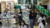 A voter casts a ballot to vote in the general election at a polling station in Bangkok, Thailand, May 14, 2023. 