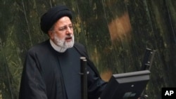 FILE - Iranian President Ebrahim Raisi addresses lawmakers at the parliament in Tehran, Iran, Jan. 22, 2023