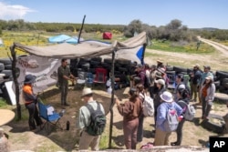 Members of the Baja California's conservation Baja Rare project lead a botanical expedition to document native plants along the U.S.-Mexico border, April 19, 2024, in the Ejido Jacume in the Tecate Municipality of Baja Calif., Mexico.