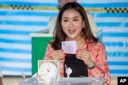 Paetongtarn Shinawatra, one of the prime minister candidates from Pheu Thai Party, casts her vote at a polling station in Bangkok, Thailand, May 14, 2023.