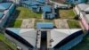 Aerial view showing the marks left by mattresses and other objects set on fire on a roof of the Guayas 4 block, in the Regional 8 prison complex in Guayaquil, Ecuador, taken on March 28, 2024, a day after an 'internal revolt.'