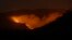 FILE - The Hermits Peak-Calf Canyon Fire burns south of Las Vegas, New Mexico, May 7, 2022. 