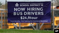 A hiring sign seeking bus drivers is posted in Palatine, Illinois, April 19, 2023. 