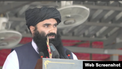 De facto Afghan Interior Minister Sirajuddin Haqqani addressing the Bagram ceremony just outside Kabul Aug 14, 2024, to mark the 3rd anniversary of the Taliban takeover.