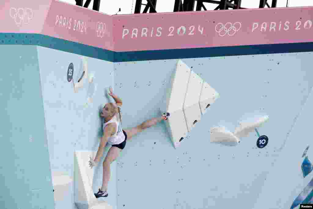 Janja Garnbret of Slovenia competes in the women&#39;s boulder and lead, semi-final boulder sport climbing race during the Paris Olympics in Le Bourget, France.