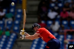 England's Harry Brook plays a shot during the ICC Men's T20 World Cup cricket match between England and South Africa at Darren Sammy National Cricket Stadium in Gros Islet, Saint Lucia, June 21, 2024.