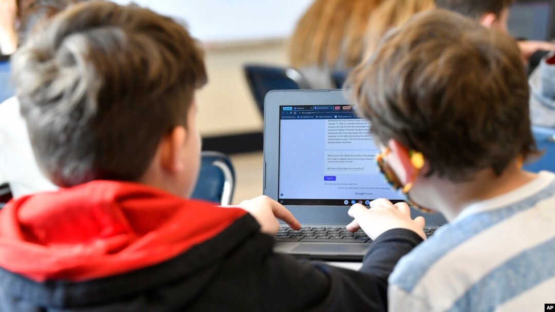 FILE - Students work on a laptop computer at Stonewall Elementary in Lexington, Kentucky, Feb. 6, 2023.