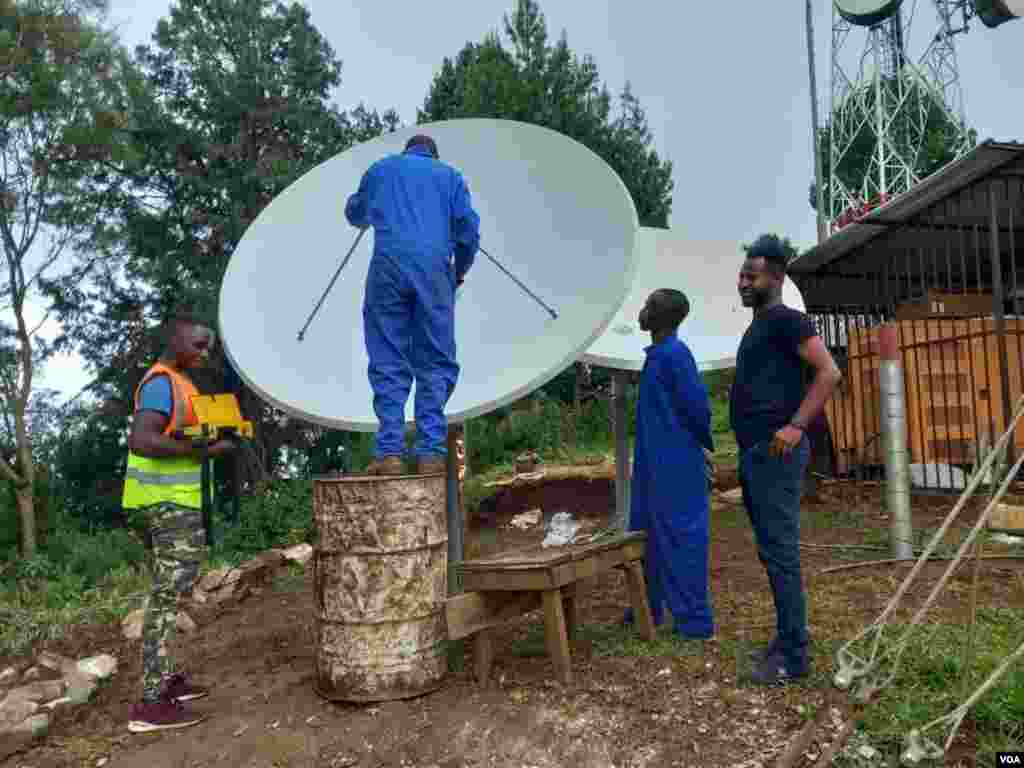Technicians make adjustments to the satellite for Voice of America’s new radio station serving the Karongi district of Rwanda.