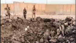 Gambar yang diambil dari video UGC yang diposting pada tanggal 20 April 2024 ini menunjukkan kerusakan akibat ledakan di pangkalan militer Irak di provinsi tengah Babilonia yang menampung koalisi kelompok bersenjata pro-Iran. (UGC/AFP)