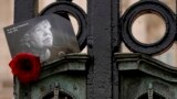 A tribute to Britain's Queen Elizabeth II is tucked into the gates of Buckingham Palace in London as Britain marks the first anniversary of her death.