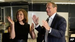 Associated Press Executive Editor Julie Pace and Director of Photography David Ake celebrate May 8, 2023, in New York upon learning that AP had won a Pulitzer Prize for breaking news photography. The AP also won a public service Pulitzer for coverage of the invasion of Ukraine. 