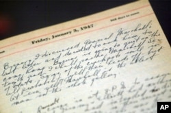 FILE - A portion of a page from a Harry Truman's 1947 presidential diary is shown at the National Archives in Washington, July 10, 2003. (AP Photo/Rick Bowmer)