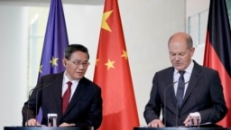 2023年6月20日，德國總理奧拉夫·朔爾茨（右）和中國總理李強在德國柏林總理府向媒體介紹兩國政府磋商後的情況。（美聯社照片）