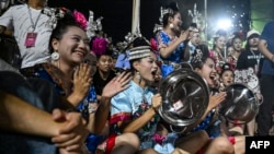 This photo taken July 31, 2023, shows supporters cheering for their village team during the final of the grassroots basketball competition CunBA in Taipan village, Taijiang county, in southwestern China's Guizhou province. 