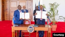 FILE — Kenyan President William Ruto and Haiti's Prime Minister Ariel Henry witnessing the signing ceremony at Kenya’s State House in Nairobi, on March 1, 2024.