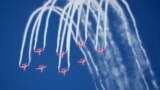 Indian Air Force's aerobatic team Suryakiran perform maneuvers on the first day of the Aero India 2023 at Yelahanka air base in Bengaluru, India, Feb. 13, 2023.
