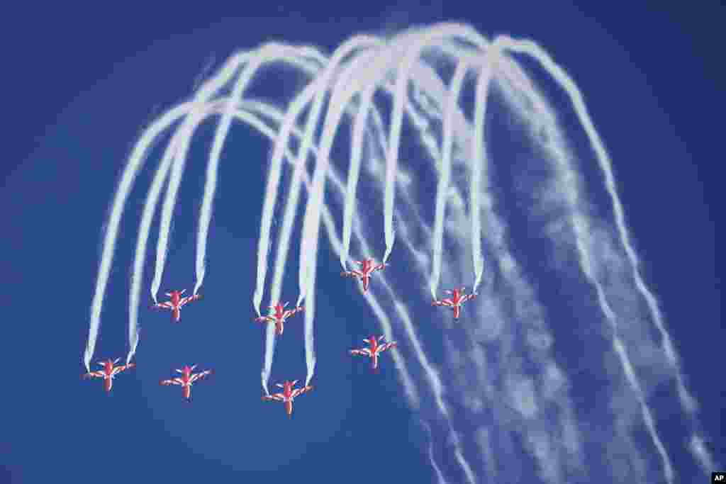 Indian Air Force&#39;s aerobatic team Suryakiran performs maneuvers on the first day of the Aero India 2023 at Yelahanka air base in Bengaluru.