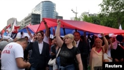 Supporters of Serbia's President Aleksandar Vucic take part in a rally backing his policies and the ruling Serbian Progressive Party (SNS), in Belgrade, Serbia, May 26, 2023.