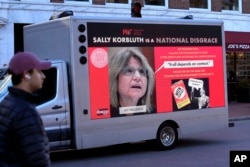 A truck with electronic panels is seen Dec. 12, 2023, near Harvard University, in Cambridge, Massachusetts, with messages critical of testimony to Congress by three university presidents regarding antisemitism. Pictured is MIT President Sally Kornbluth.