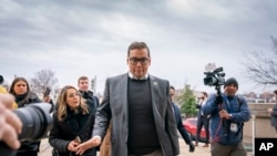 FILE - Rep. George Santos, R-N.Y., leaves a House GOP conference meeting on Capitol Hill in Washington, Jan. 25, 2023.