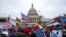 FILE - Supporters of President Donald Trump rally at the U.S. Capitol in Washington on Jan. 6, 2021.