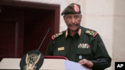 FILE - Sudan's Army chief Gen. Abdel-Fattah Burhan speaks in Khartoum, Dec. 5, 2022. Burhan accused, Aug. 13, 2023, the Rapid Support Forces and Commander Mohammed Hamdan Dagalo of committing violations under the falsehood of promising to restore democracy.