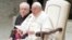 Pope Francis delivers his message as he meets with Vatican employees for the season greetings at the Vatican, Dec. 21, 2023.