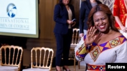 Meaza Mohammed from Ethiopia waves as she leaves the East Room of the White House after being honored at the 17th annual International Women of Courage (IWOC) Award Ceremony at the White House, March 8, 2023. 