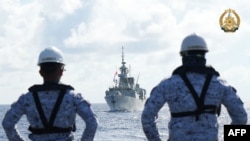 Philippine sailors watching Canada's HMCS Montreal during the joint Philippines, US, Canada, and Australia Multilateral Maritime Cooperative Activity (MMCA) in the South China Sea. (Armed Forces of the Philippines/ AFP) 