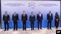 The foreign ministers of Turkmenistan, Tajikistan, China, Uzbekistan, Russia, Iran and Pakistan, all neighbors of Afghanistan, are pictured at their meeting in Samarkand, Uzbekistan, April 13, 2023. (Russian Foreign Ministry Press Service via AP)