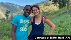 In this undated photo provided by El Roi Haiti, Alix Dorsainvil, right, poses with her husband, Sandro Dorsainvil. Alix Dorsainvil, a nurse for El Roi Haiti, and her daughter were kidnapped on July 27, the organization said.