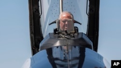 US Air Force Secretary Frank Kendall sits in the front cockpit of an X-62A VISTA aircraft at Edwards Air Force Base, Calif., on May 2, 2024.