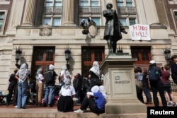 Student protesters move supplies from outside Hamilton Hall, where students at Columbia University have barricaded themselves inside as they continue to protest in support of Palestinians.
