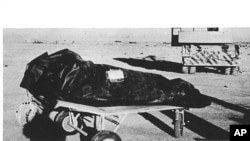 FILE - This photo is from the U.S. Air Force's "The Roswell Report," released June 24, 1997, which discusses the alleged UFO incident in Roswell, New Mexico in 1947. On balloon flights, test dummies were used and placed in insulation bags to protect temperature sensitive equipment. These bags may have been described by at least one witness as "body bags" used to recover alien victims from the crash of a flying saucer. (US Air Force via AP)