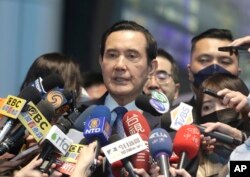 Former Taiwan President Ma Ying-jeou talks to the press before leaving for China at Taoyuan International Airport in Taoyuan City, Northern Taiwan, March 27, 2023.