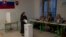 A Catholic nun casts her ballot at a polling station in Bratislava, Slovakia, Sept. 30, 2023.